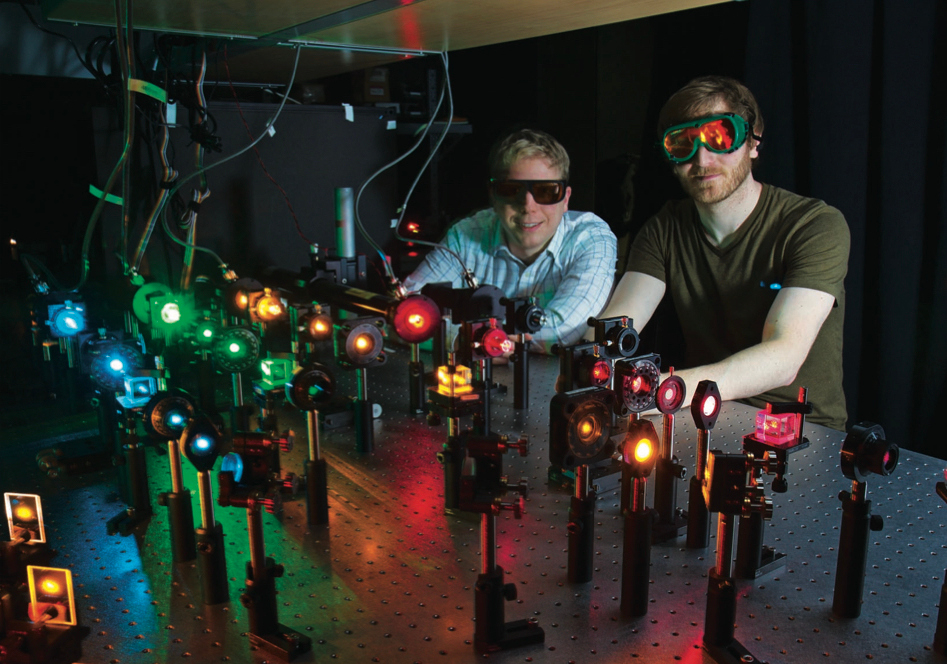 Biophysics PhD student Josh Larson and Prof. Aaron Hoskins at the laser table